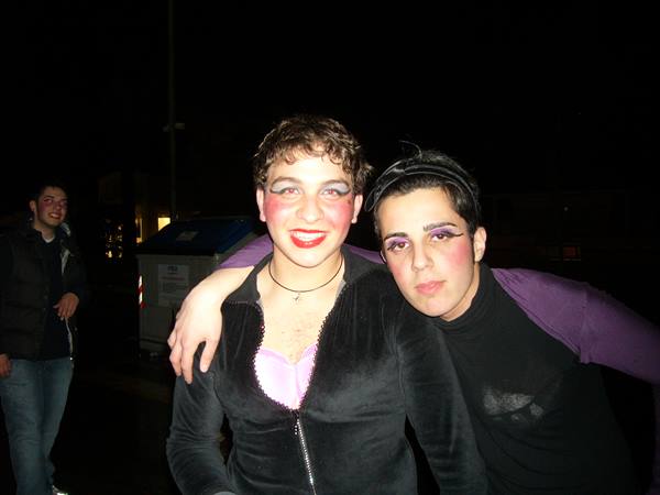 Two costumed people in drag makeup at night, Viareggio Carnival