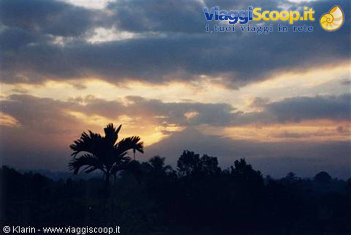 Borobudur - the sun is coming out from behind Mount Merapi