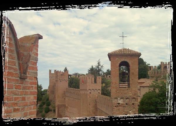 Brick crenellated walls and bell tower under cloudy sky