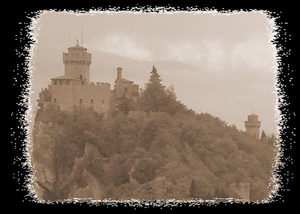 Guaita and Cesta towers on a tree-covered cliff, sepia photo