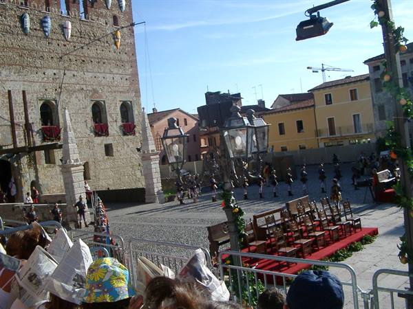 Medieval armored parade in front of Marostica castle, crowd watching