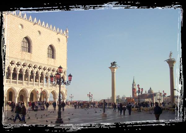 St Mark's Square in Venice: Doge's Palace, winged lion column and tourists