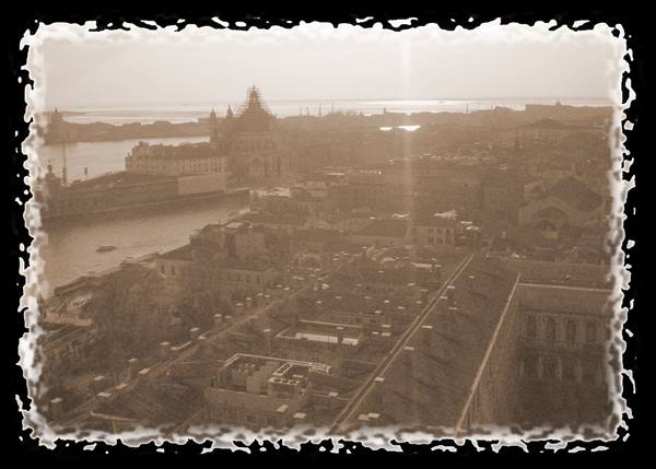 Venice: rooftops toward Salute Basilica and the lagoon, sepia tone