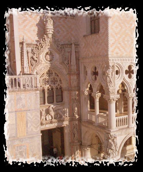 Porta della Carta and Gothic loggia of Doge's Palace in Venice, white marble in sunlight