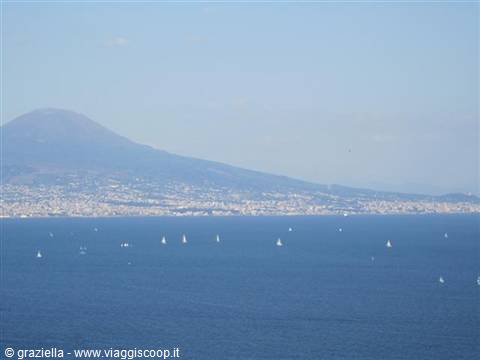 White sails on the Gulf of Naples with Mount Vesuvius in the background