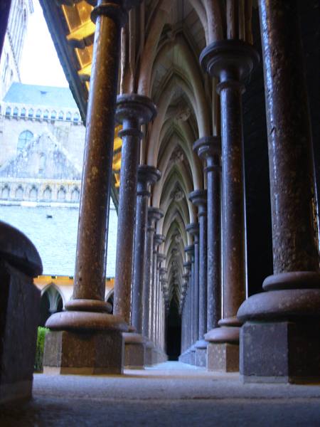 Gothic stone cloister with arched columns and vaults, Mont Saint-Michel