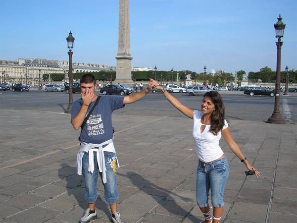 Couple dancing on Place de la Concorde, obelisk behind, daylight