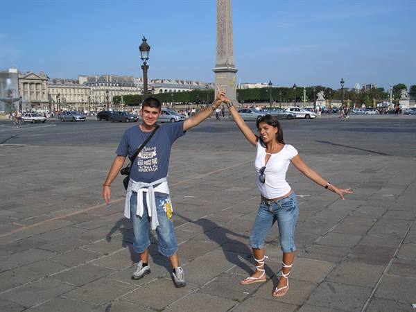 Couple posing at Place de la Concorde, Luxor Obelisk in the background