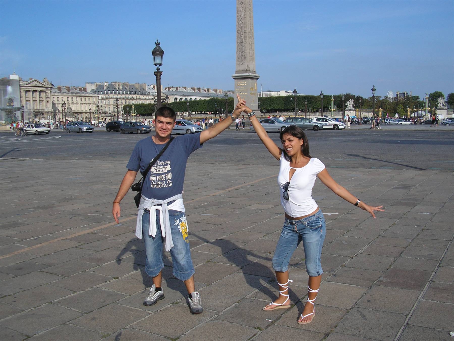Couple posing at Place de la Concorde, Luxor Obelisk in the background