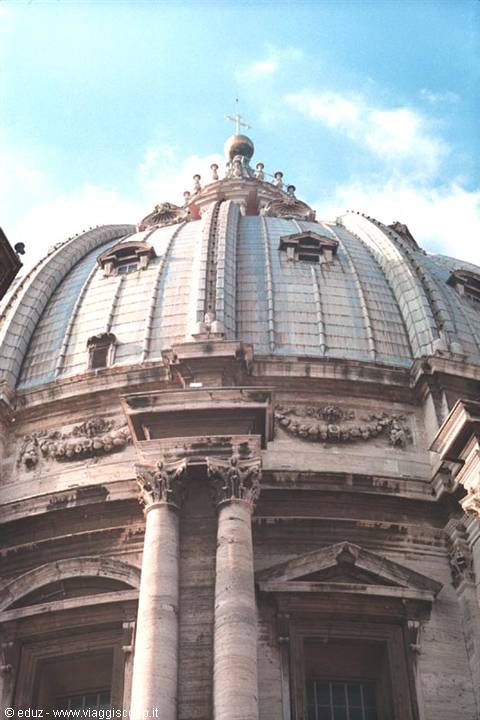 St Peter's dome: travertine drum with columns and lantern against the blue sky