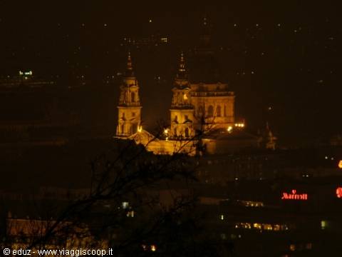 St. Stephen's Basilica in Budapest lit up at night among city lights