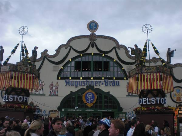 Crowd in front of the Augustiner-Bräu tent at Munich Oktoberfest, cloudy sky