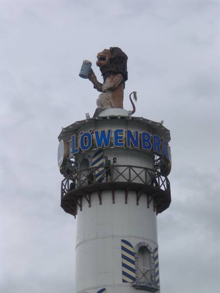 The Löwenbräu tower at Munich Oktoberfest, lion raising a beer stein