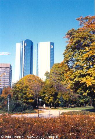 Deutsche Bank towers rising above autumn trees in the garden