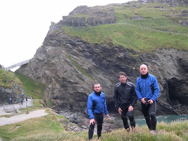 IN THE BACKGROUND THE RUINS OF TINTAGEL CASTLE