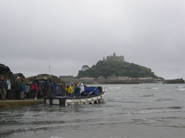 A BOAT BRINGS US TO SAFETY AT MONT SAINT MICHEL 