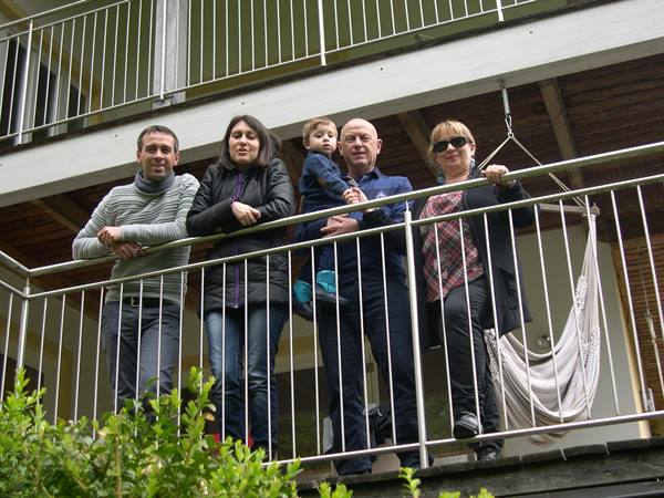 LEANING OVER THE BALCONY AT THE PFARRKIRCHEN HOUSE