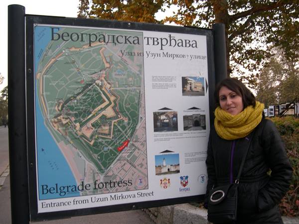 Tourist next to the map sign of Belgrade Fortress