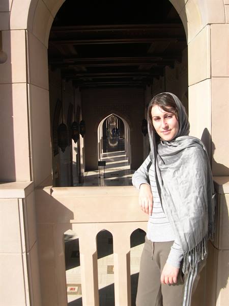 VALENTINA LEANING OUT FROM THE ARCHES OF THE MOSQUE