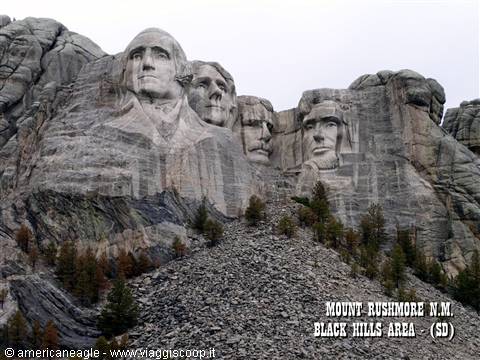 Presidential faces carved into granite at Mount Rushmore among pine trees