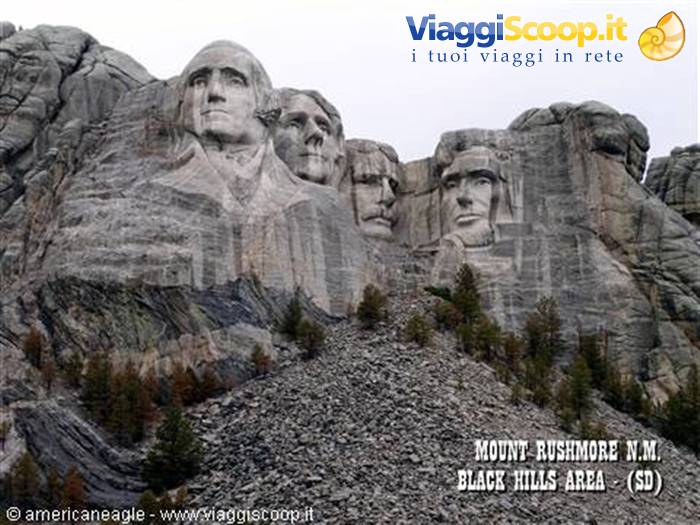 Presidential faces carved into granite at Mount Rushmore among pine trees