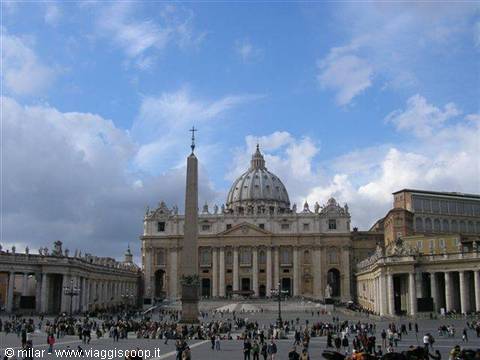 St. Peter's Square with the Egyptian obelisk and basilica under a cloudy sky