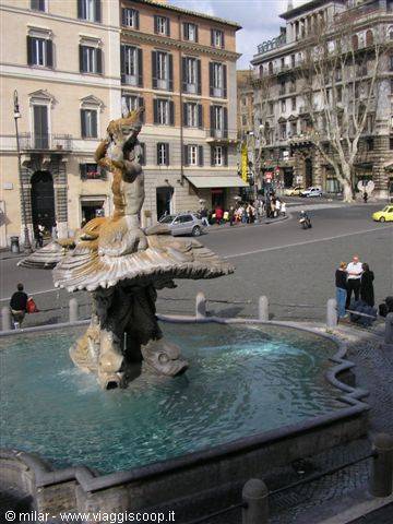 Marble triton fountain on a square with historic buildings and pedestrians