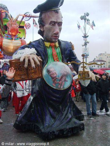Carnival float at Viareggio: giant paper-mâché figure holding scales and a globe