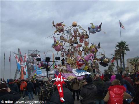 Viareggio Carnival: allegorical float with performers among the crowd