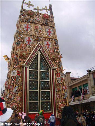 Viareggio Carnival: golden parade float with studded door and heraldic shields