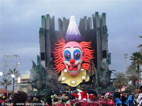 Giant papier-mâché clown float at Viareggio Carnival, crowd celebrating below