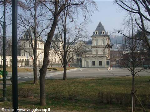 Turin's Castello del Valentino with its twin towers seen from bare park