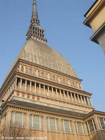 Turin's Mole Antonelliana, brick dome rising against a clear blue sky