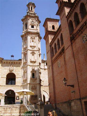 Baroque stone tower and brick facade of El Paular monastery