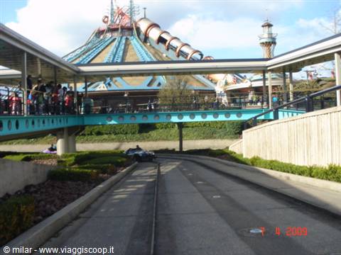 Turquoise walkway and Space Mountain roller coaster at Disneyland Paris