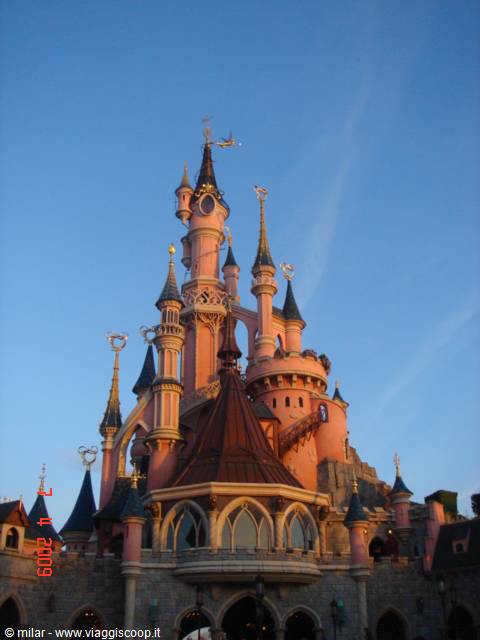 Sleeping Beauty Castle at Disneyland Paris under a clear blue sky