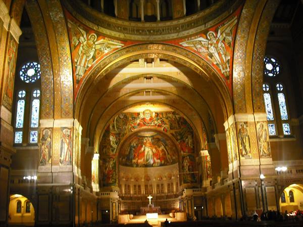 Inside Lisieux basilica, golden mosaics, frescoes and lit altar