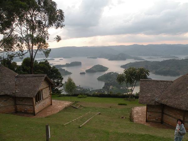Thatched cottages overlooking Lake Bunyonyi, green islands among misty hills