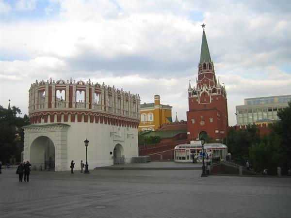 Troitskaya Kremlin tower and Alexander Garden under white clouds in Moscow