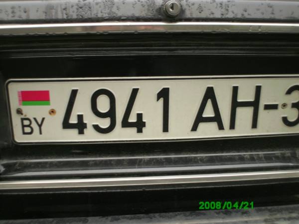 Belarus license plate 4941 AH-3 on a rain-soaked car