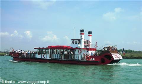 Red and white paddle steamer TK cruises full of tourists