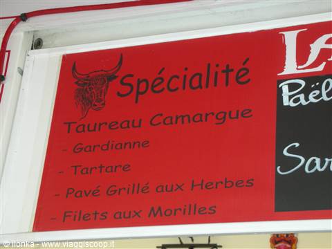 Red Camargue bull meat sign listing gardianne, tartare and grilled herb steak