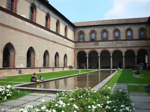 Courtyard of Sforza Castle in Milan, with arcades, flowerbeds and reflecting pool