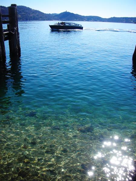 from the island of S. Giulio, view of the lake and boat