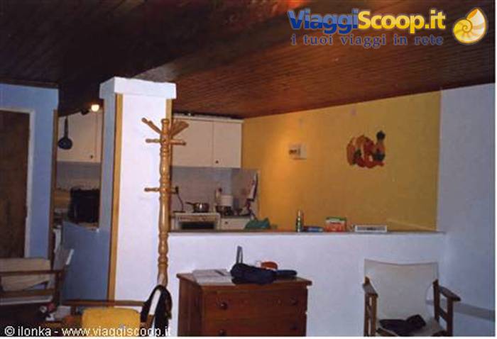 house...view of the kitchen taken from the sleeping area....