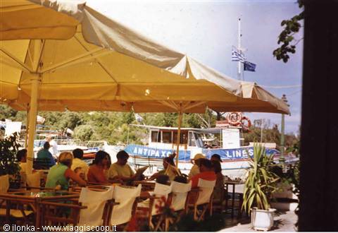 main square of gaios, port view with boat to antipaxos