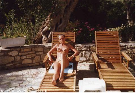 home garden, sun loungers and olive trees