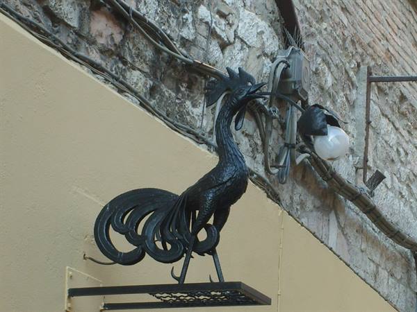 glowing - sign - of the shop 'il gallo nero'