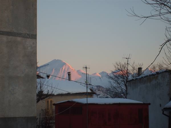 sunset over the mountains seen from the village of mascioni