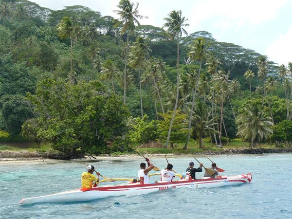 Outrigger canoe along the coast of Tahaa